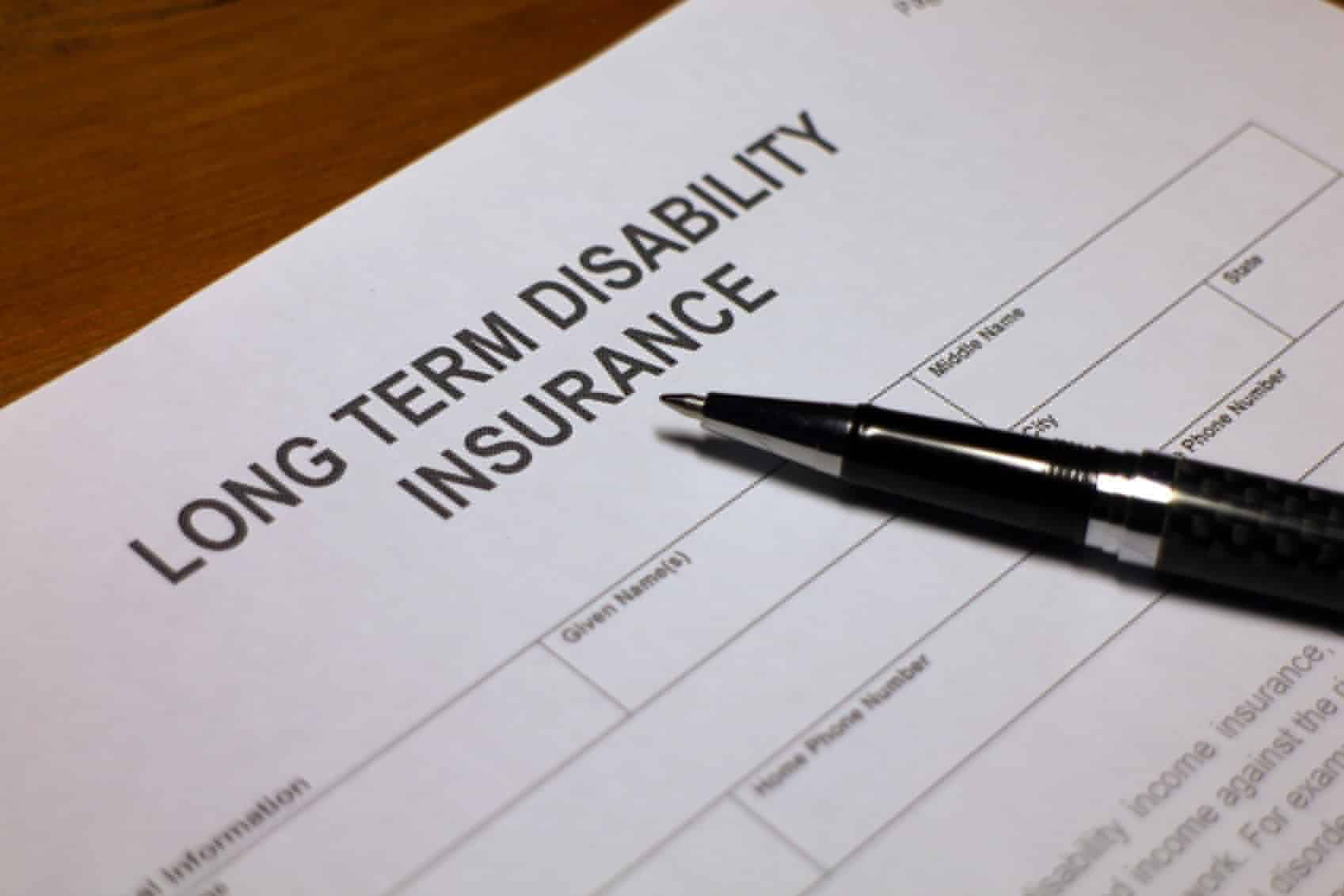 Someone filling out Long term Disability Insurance Application Form.